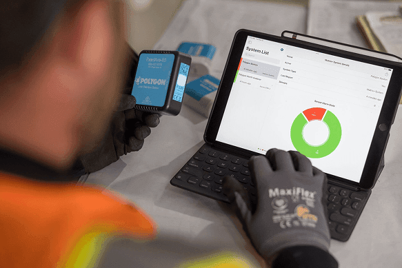 monitor-photo-o Technician monitoring water leak detection system on tablet.